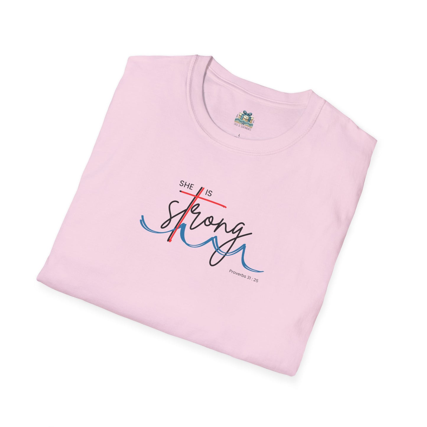 Pink t-shirt with 'She is Strong' text on a white background