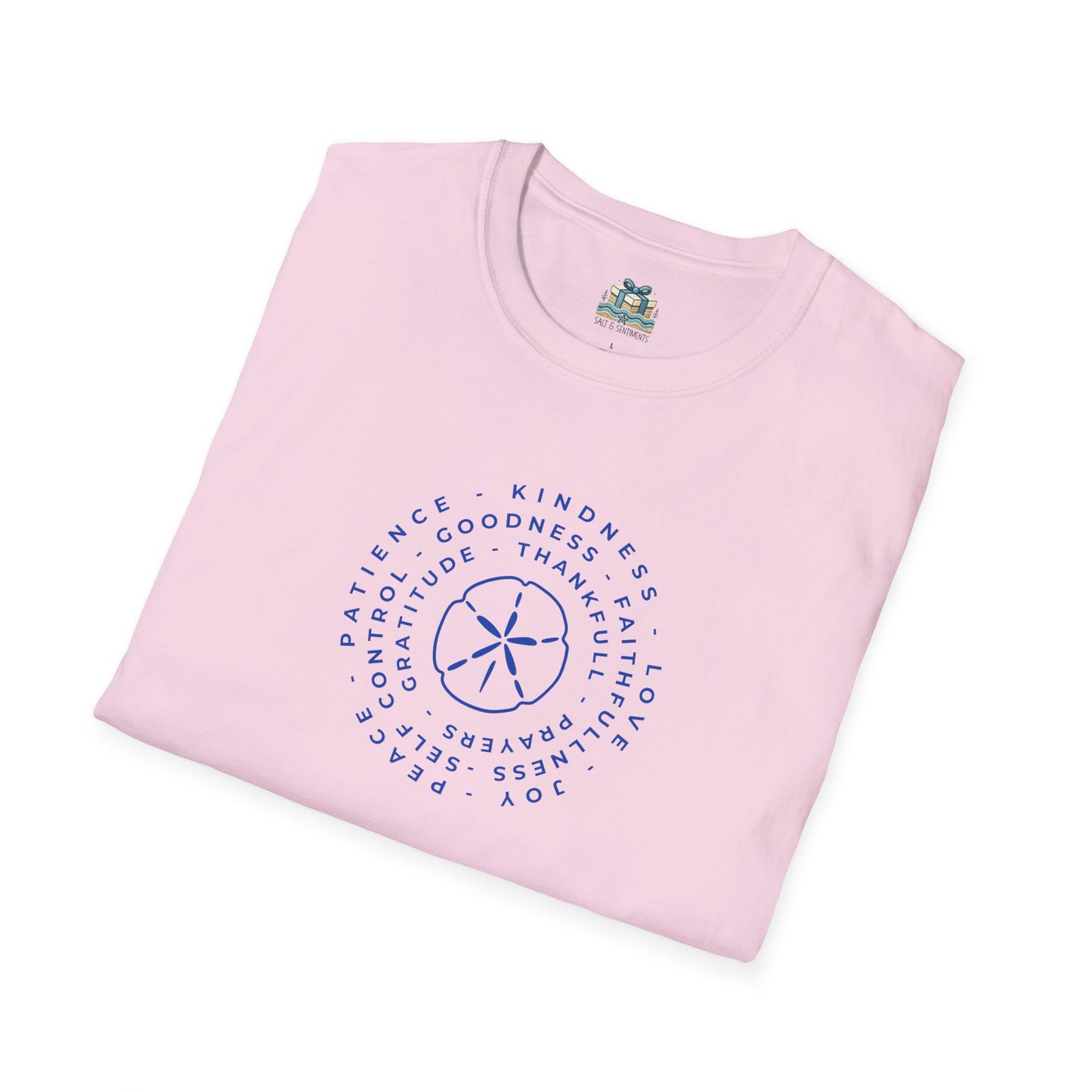Folded pink t-shirt with a blue circular design and text on a white background