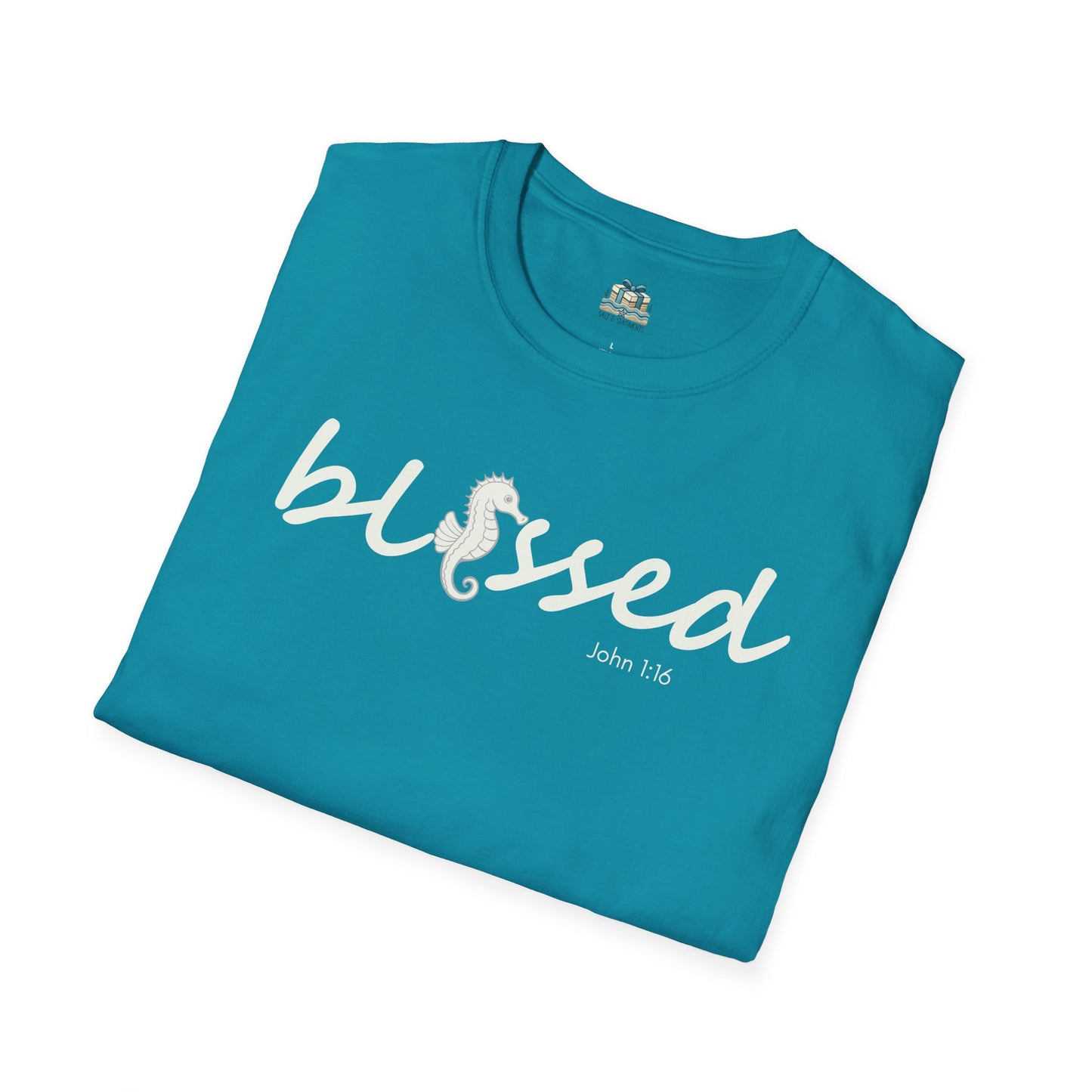 Folded teal t-shirt with 'blessed' text on a white background