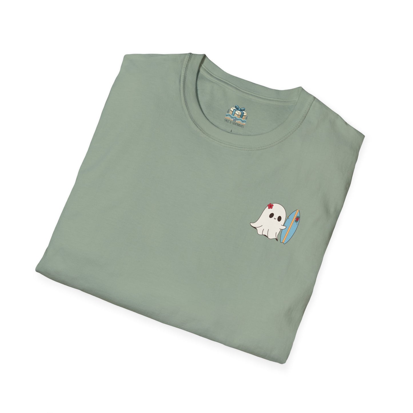 Folded light green t-shirt with a ghost and rainbow design on a white background