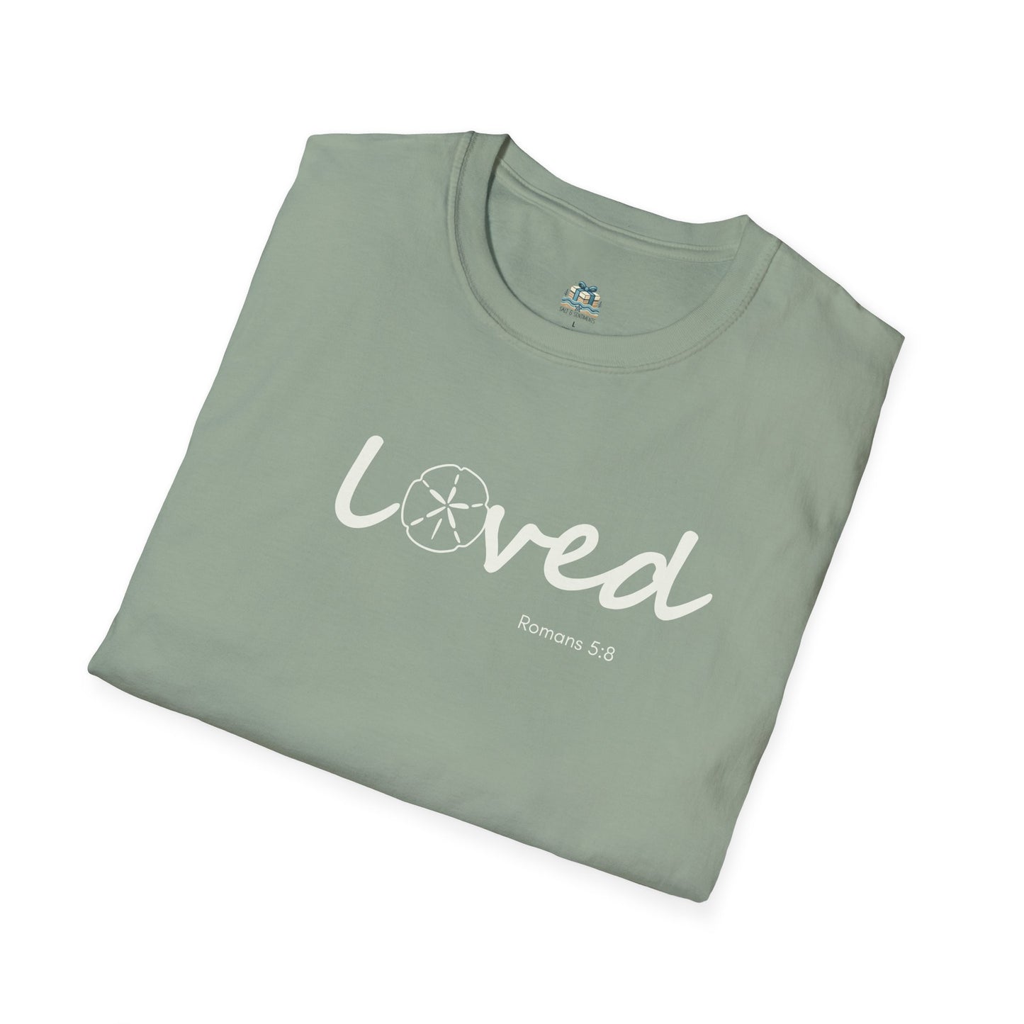 Folded green t-shirt with 'loved' text on a white background