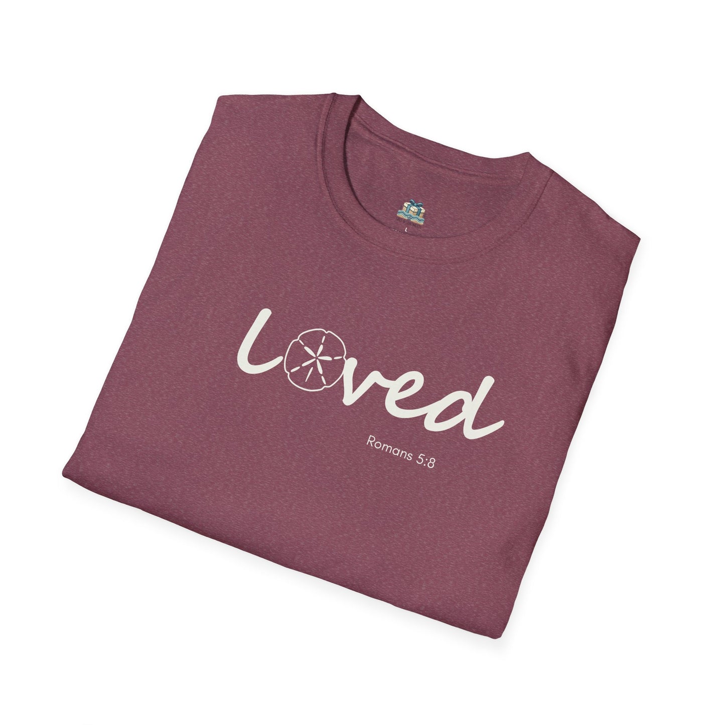 Folded maroon t-shirt with 'loved' text on a white background