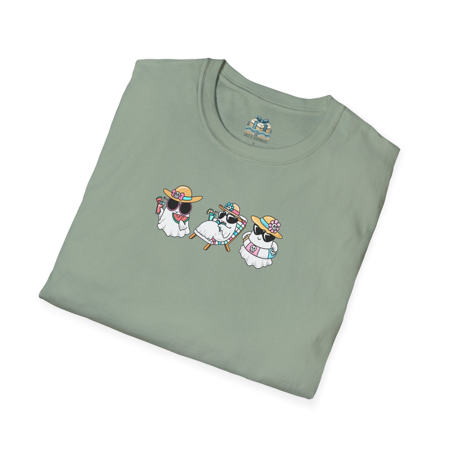 Folded green t-shirt with a graphic of three cartoon dogs wearing sunglasses and hats on a white background.