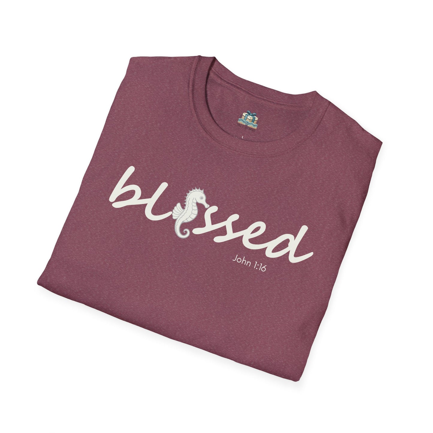 Folded maroon t-shirt with 'blessed' text on a white background