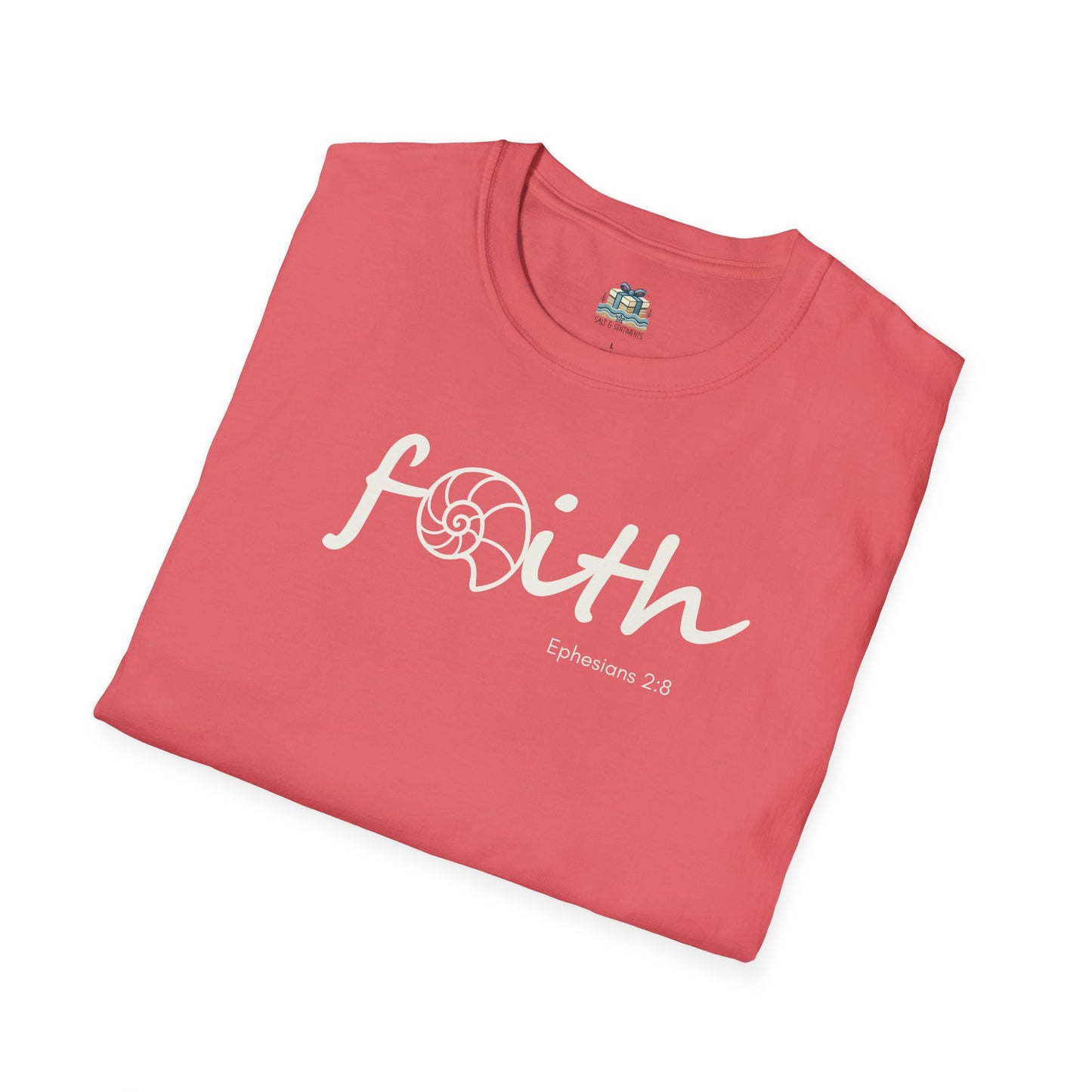 Folded pink t-shirt with 'Faith' text on a white background