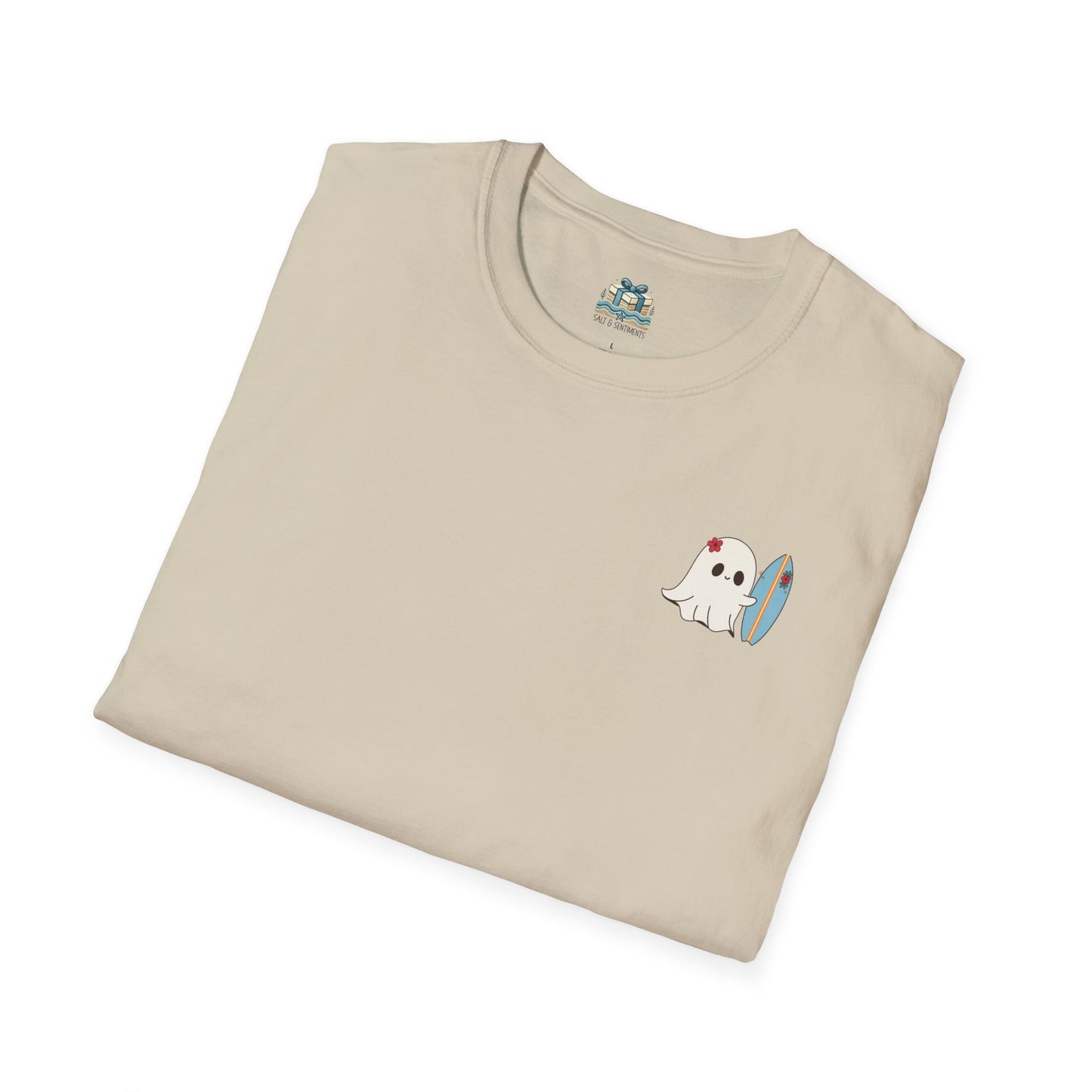 Folded beige t-shirt with a ghost and surfboard design on a white background