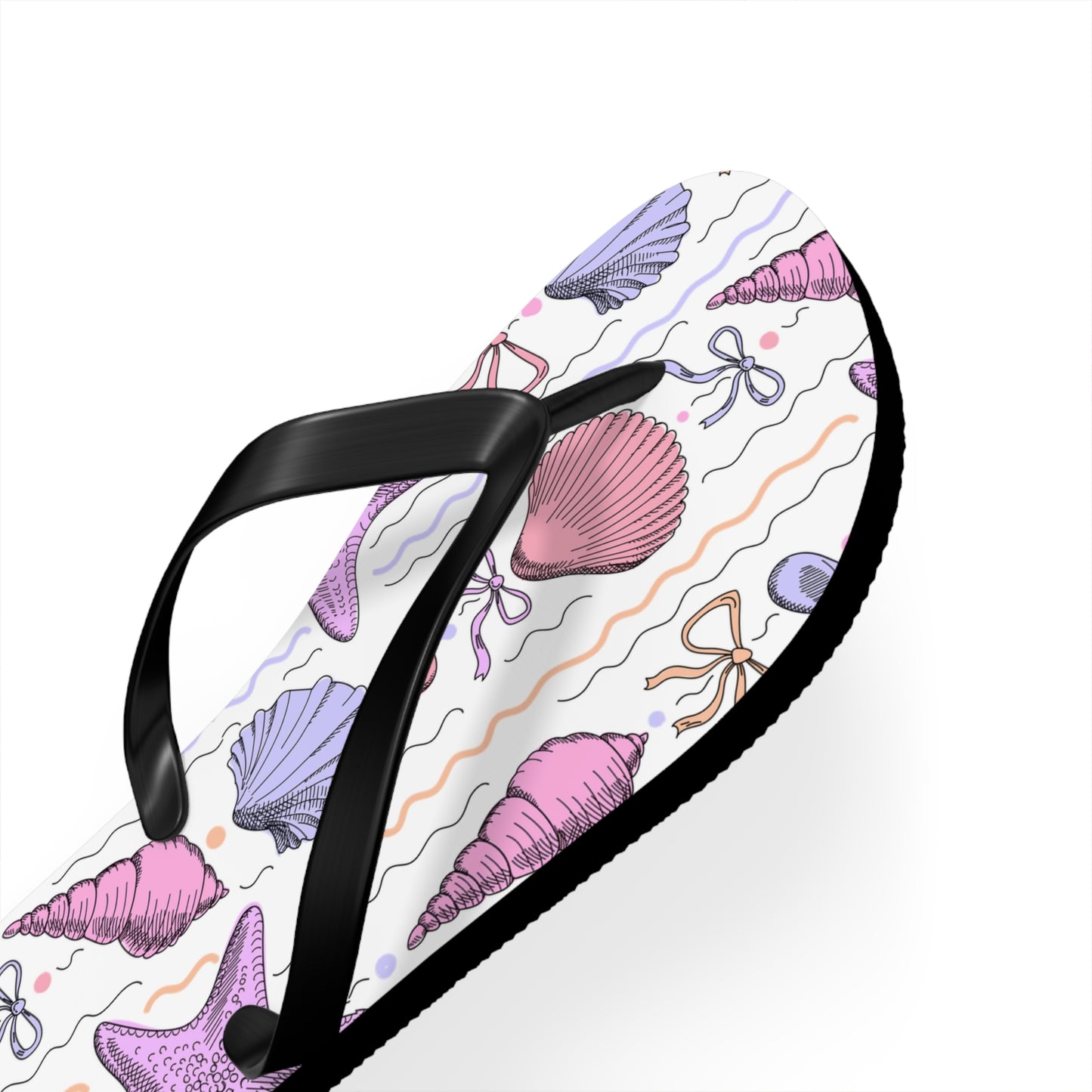 Black sandal with a colorful shell pattern on a white background