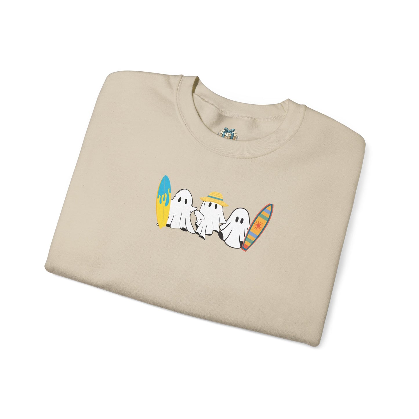Folded beige t-shirt with cartoon ghosts design on a white background