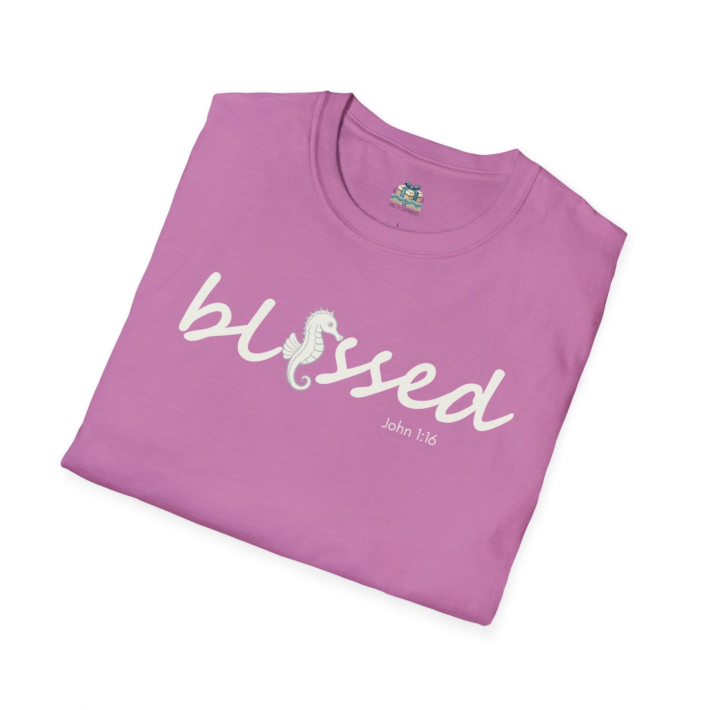 Folded purple t-shirt with 'blessed' text on a white background