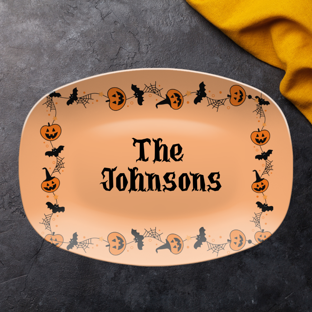 Halloween-themed platter with 'The Johnsons' text on a dark surface