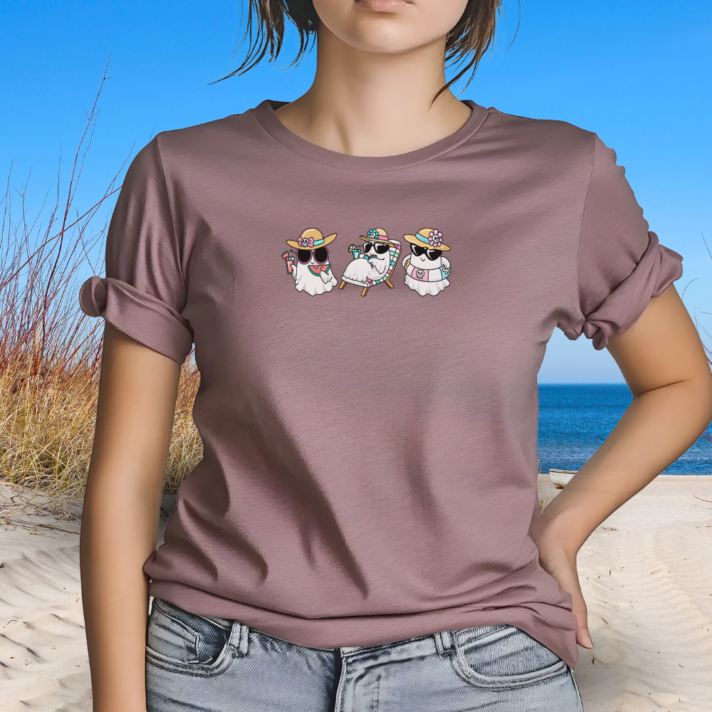 Person wearing a brown t-shirt with cartoon characters on a beach
