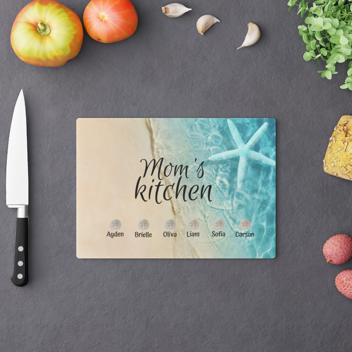 Personalized beach-themed tempered glass cutting board with kids' names for Mom’s kitchen decor and daily use.