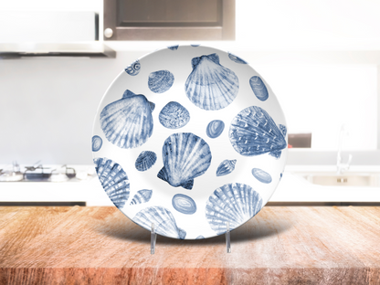 Coastal shell-themed dinner plate on kitchen counter