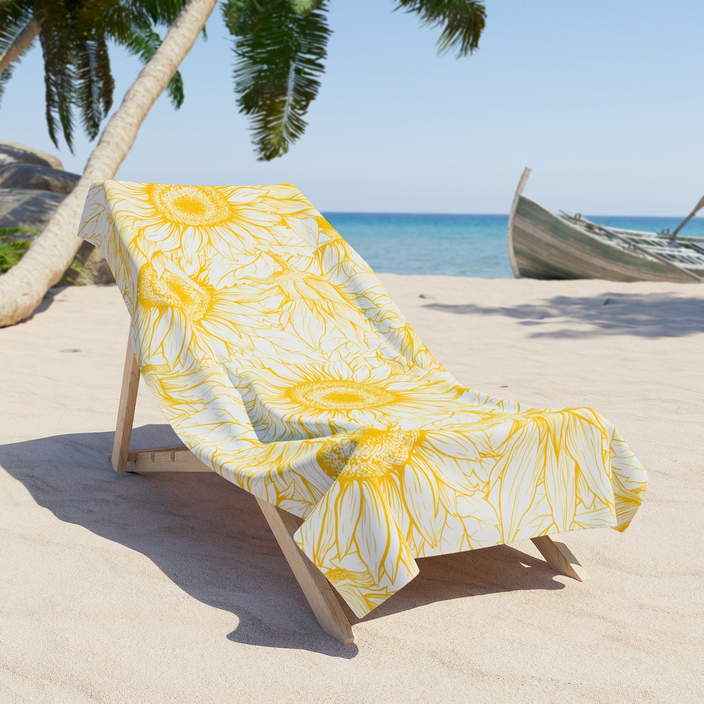 Beach chair with a yellow floral towel on a sandy beach with palm trees and a boat in the background.