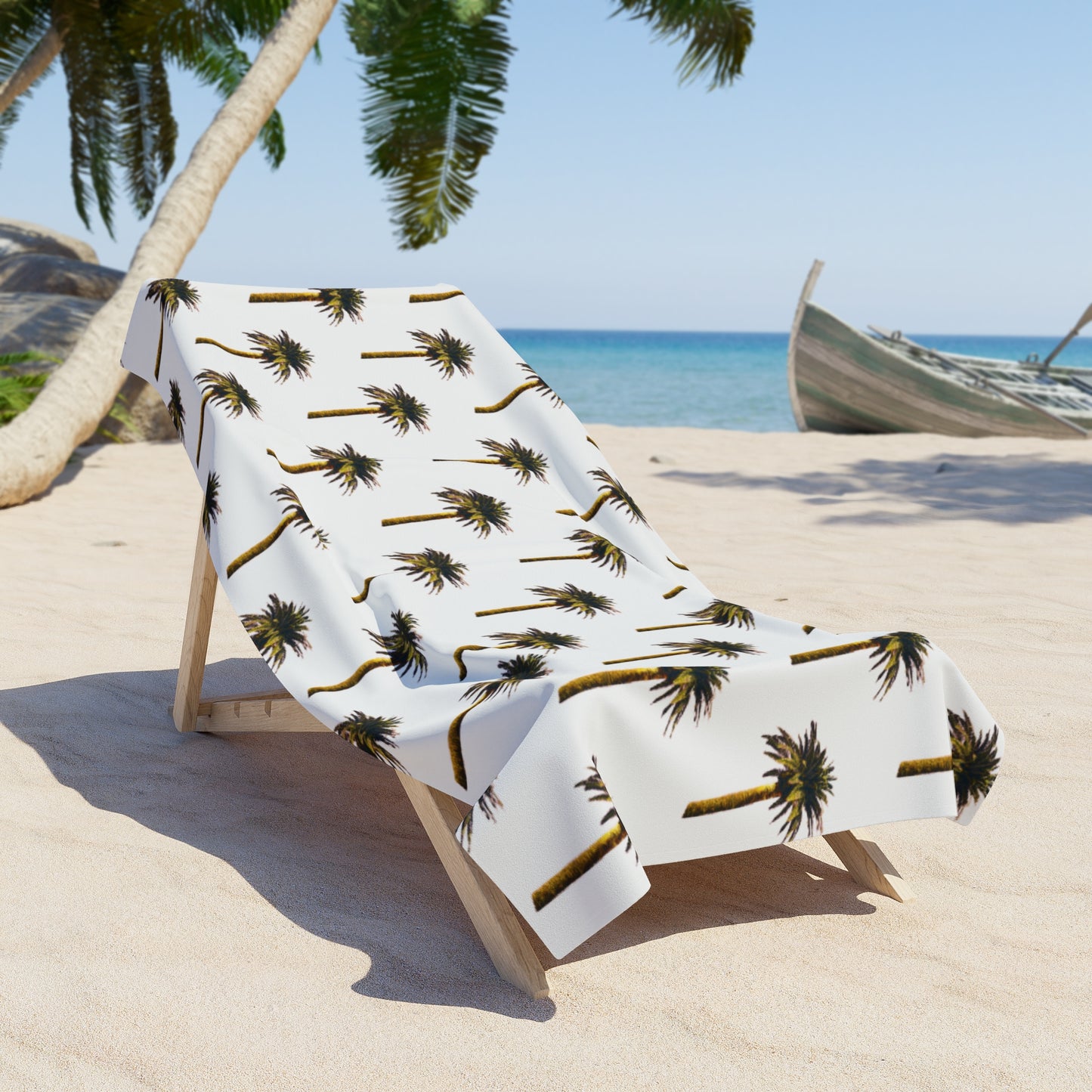 Beach towel with palm tree pattern on a lounge chair at a tropical beach.