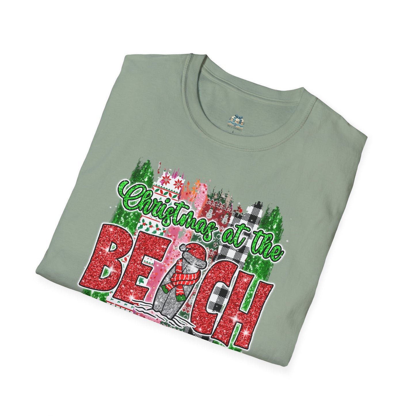 Folded t-shirt with 'Christmas at the Beach' design on a white background