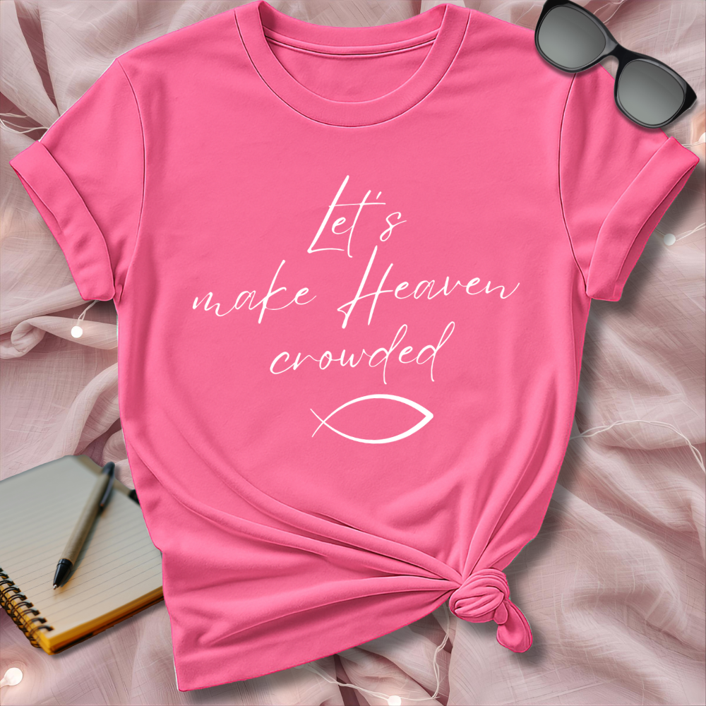 Pink t-shirt with text and fish symbol on a soft pink background