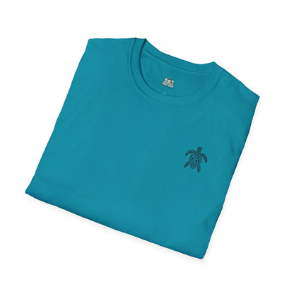 Folded teal t-shirt with a small turtle logo on a white background