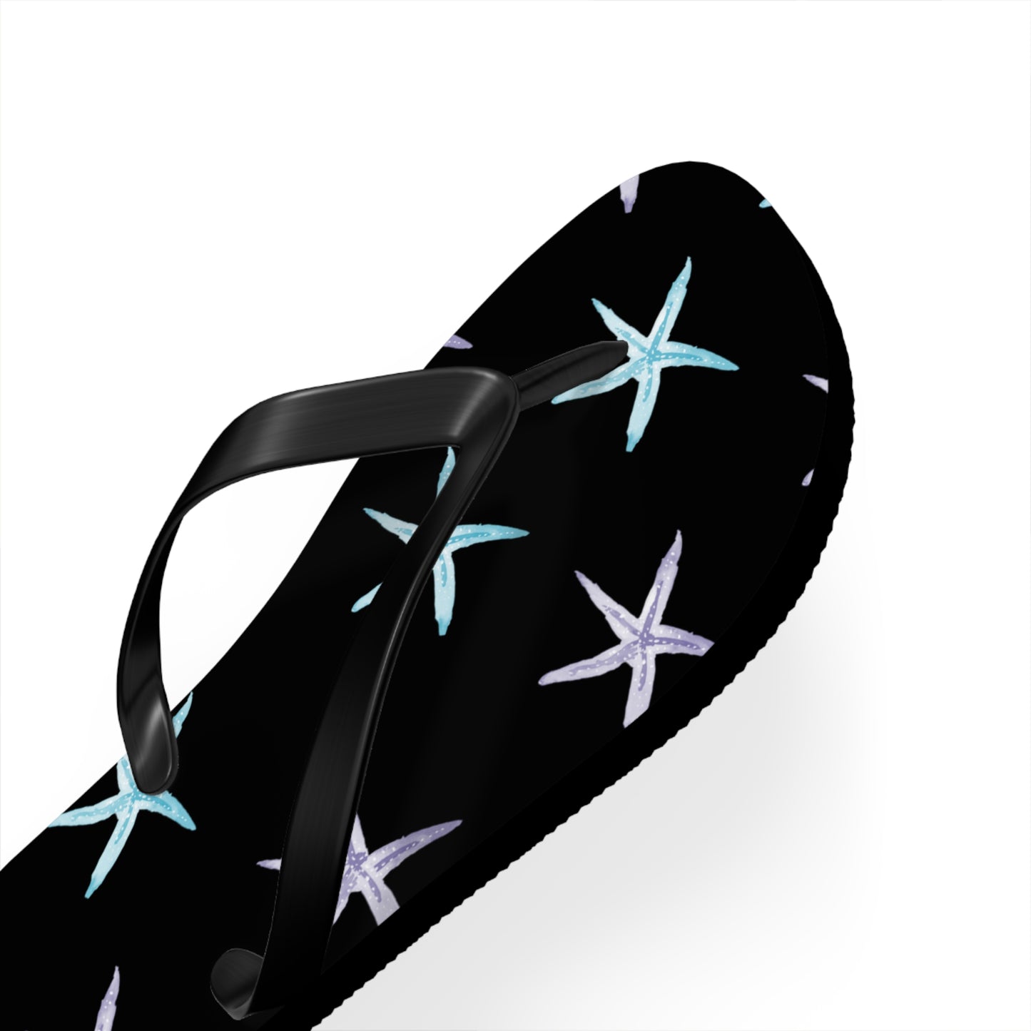 Black sandal with starfish pattern on a white background