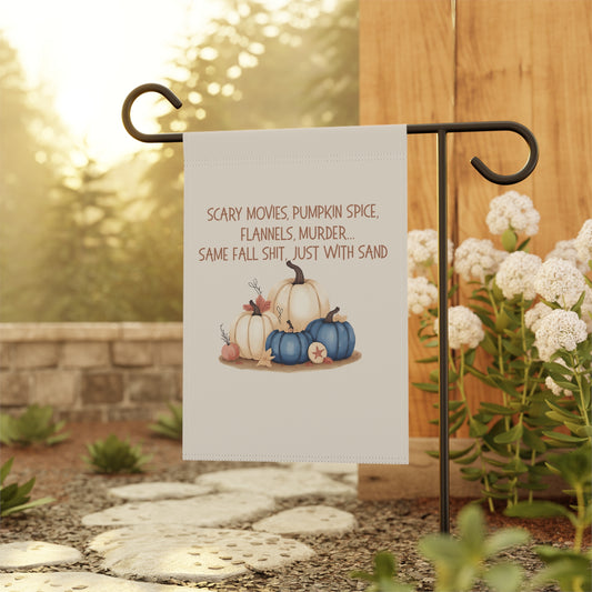 Garden flag with pumpkins and text on a stand outdoors