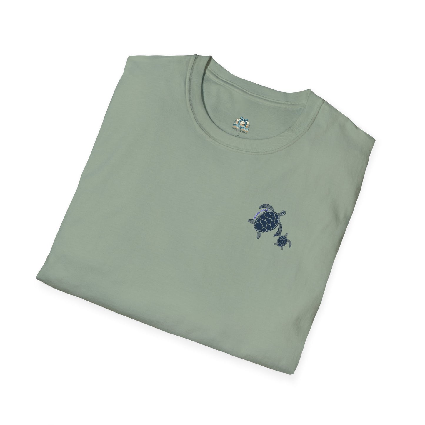 Folded green t-shirt with a turtle design on a white background