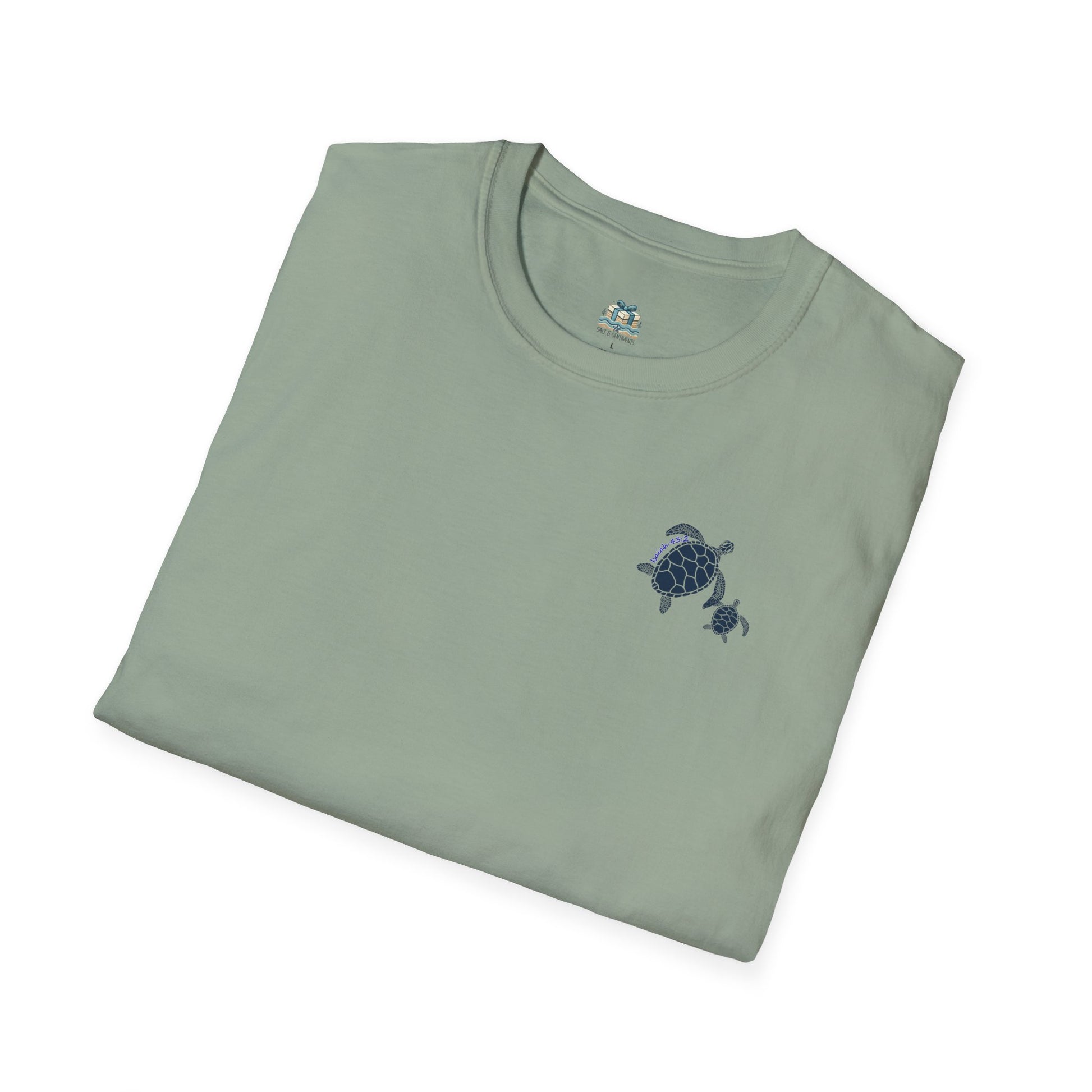 Folded green t-shirt with a turtle design on a white background