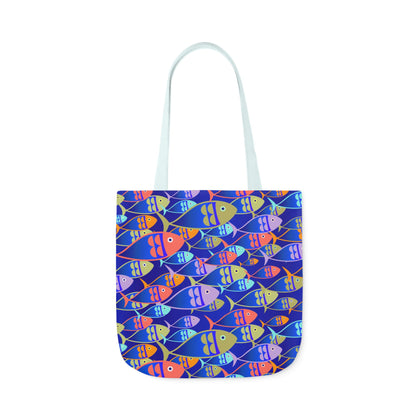 blue strapped Tote bag featuring colorful fish pattern on a deep blue background with white handles, size 18x18 inches.
