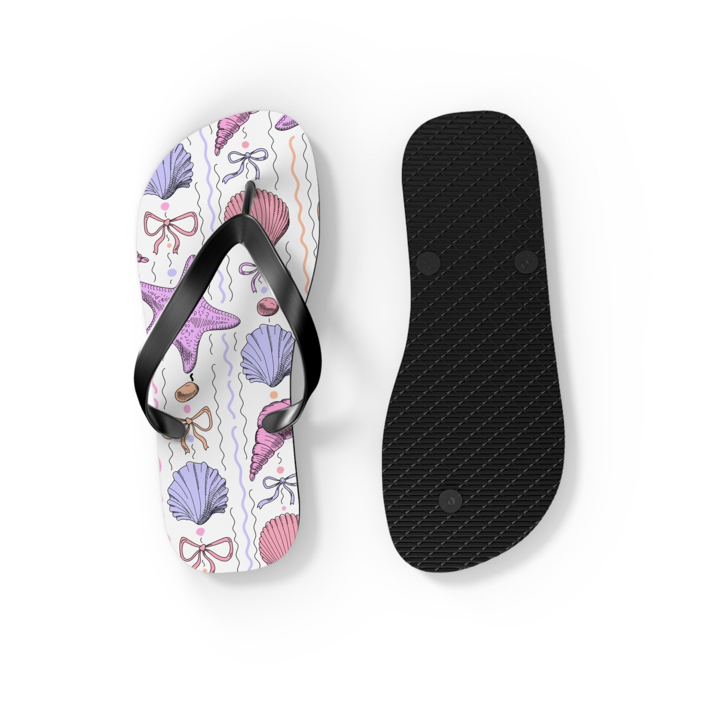 Flip-flop with shell and bow pattern and black insole on a white background