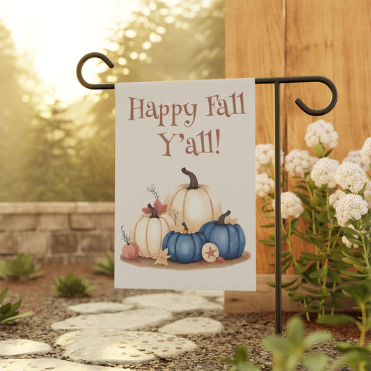 Garden flag with 'Happy Fall Y'all!' text and pumpkins on a stand outdoors.