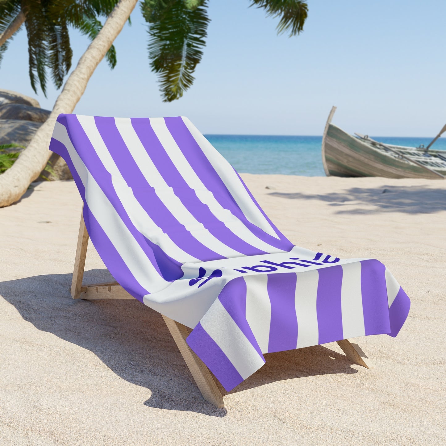 Beach chair with purple and white striped towel on a sandy beach with palm trees and ocean in the background.