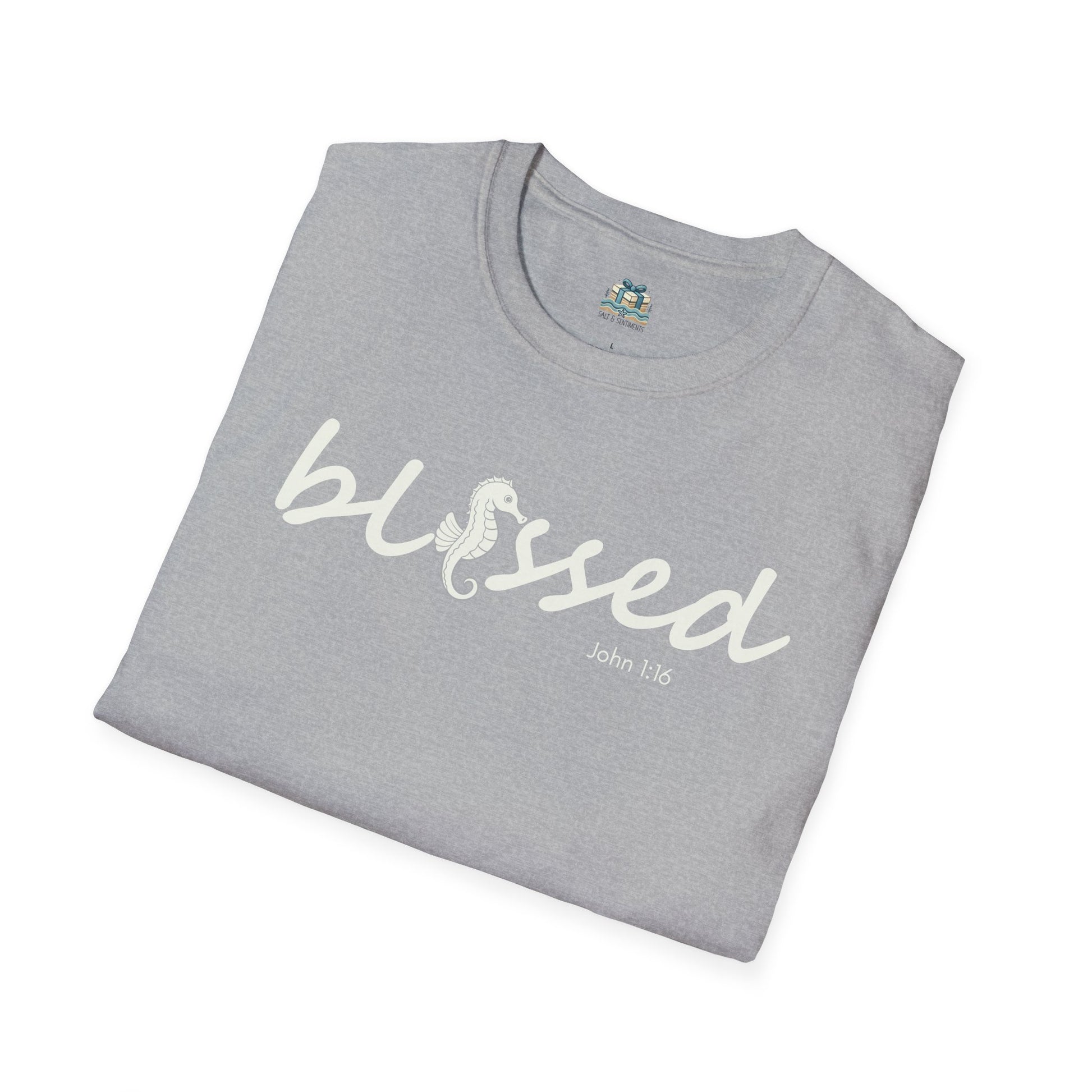 Folded gray t-shirt with 'blessed' text on a white background