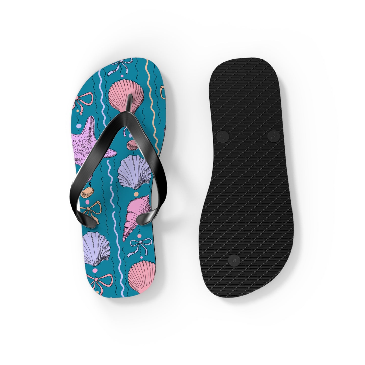 Flip-flop with seashell pattern and black insole on a white background