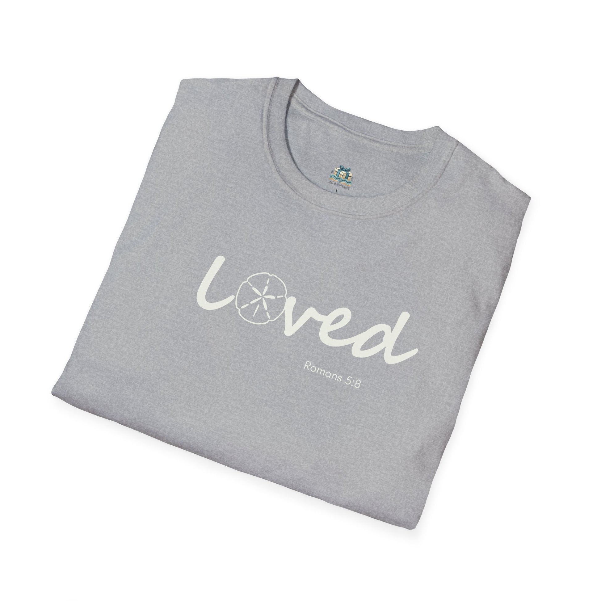 Folded gray t-shirt with 'loved' text on a white background