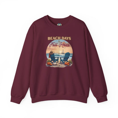 Maroon sweatshirt with beach-themed graphic and text on a white background
