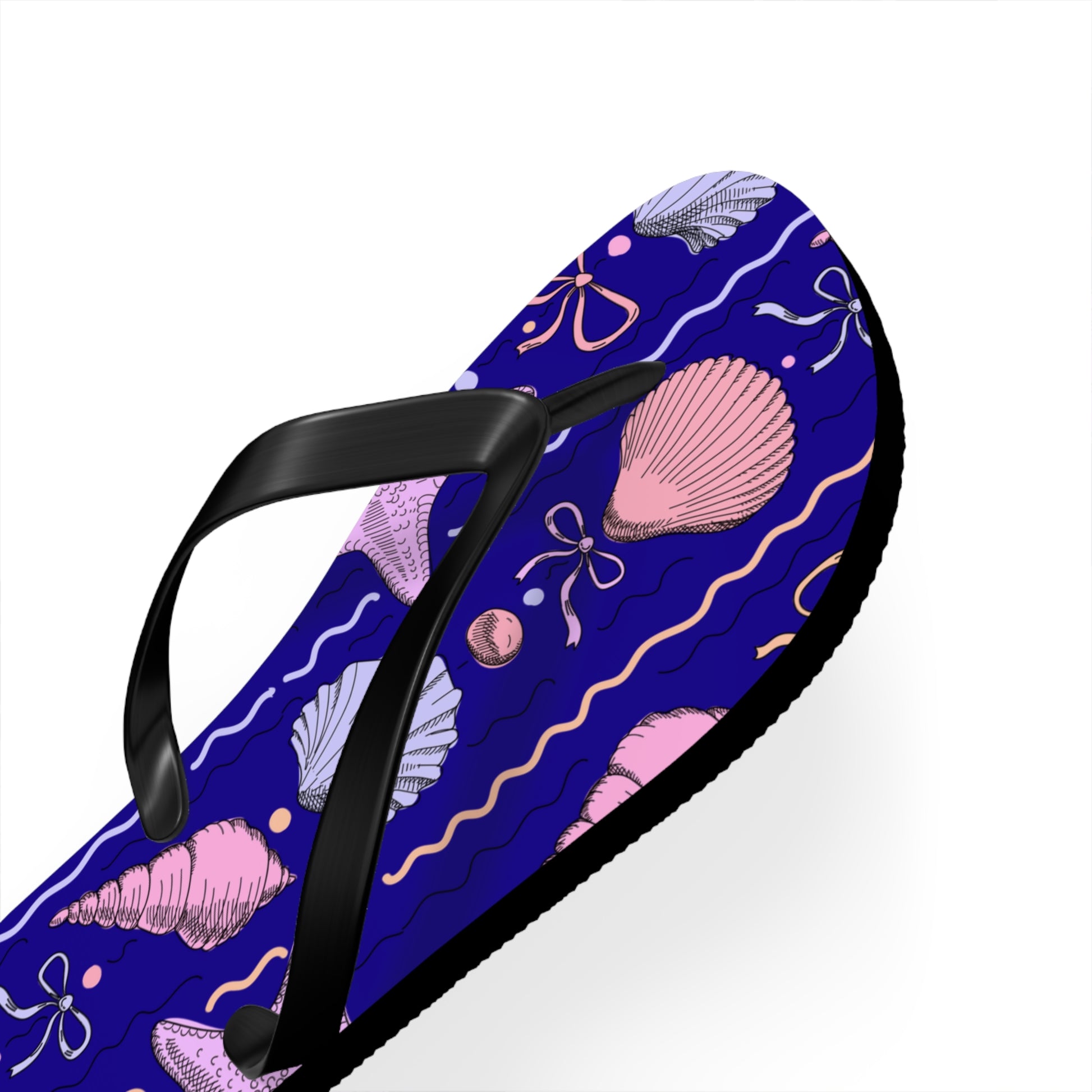 Flip-flop with pink shell and bow pattern on a blue background