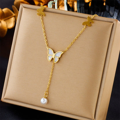 Elegant gold necklace set on display with modern romantic designs

