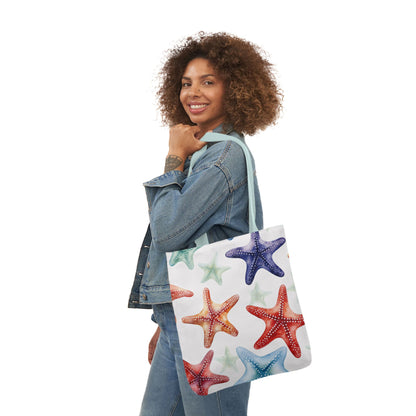 18 x 18 beach tote with multicolor starfish pattern on white background with blue straps