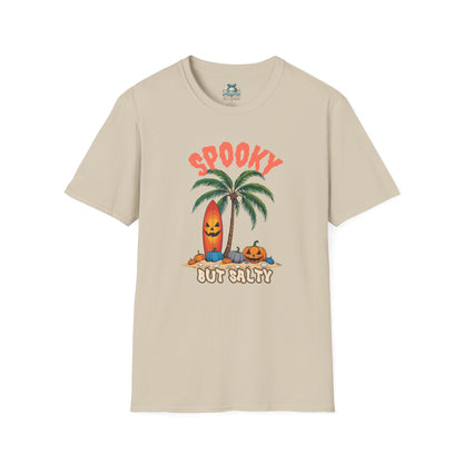 Beige t-shirt with Halloween-themed design featuring a palm tree, surfboard, and pumpkins on a white background.