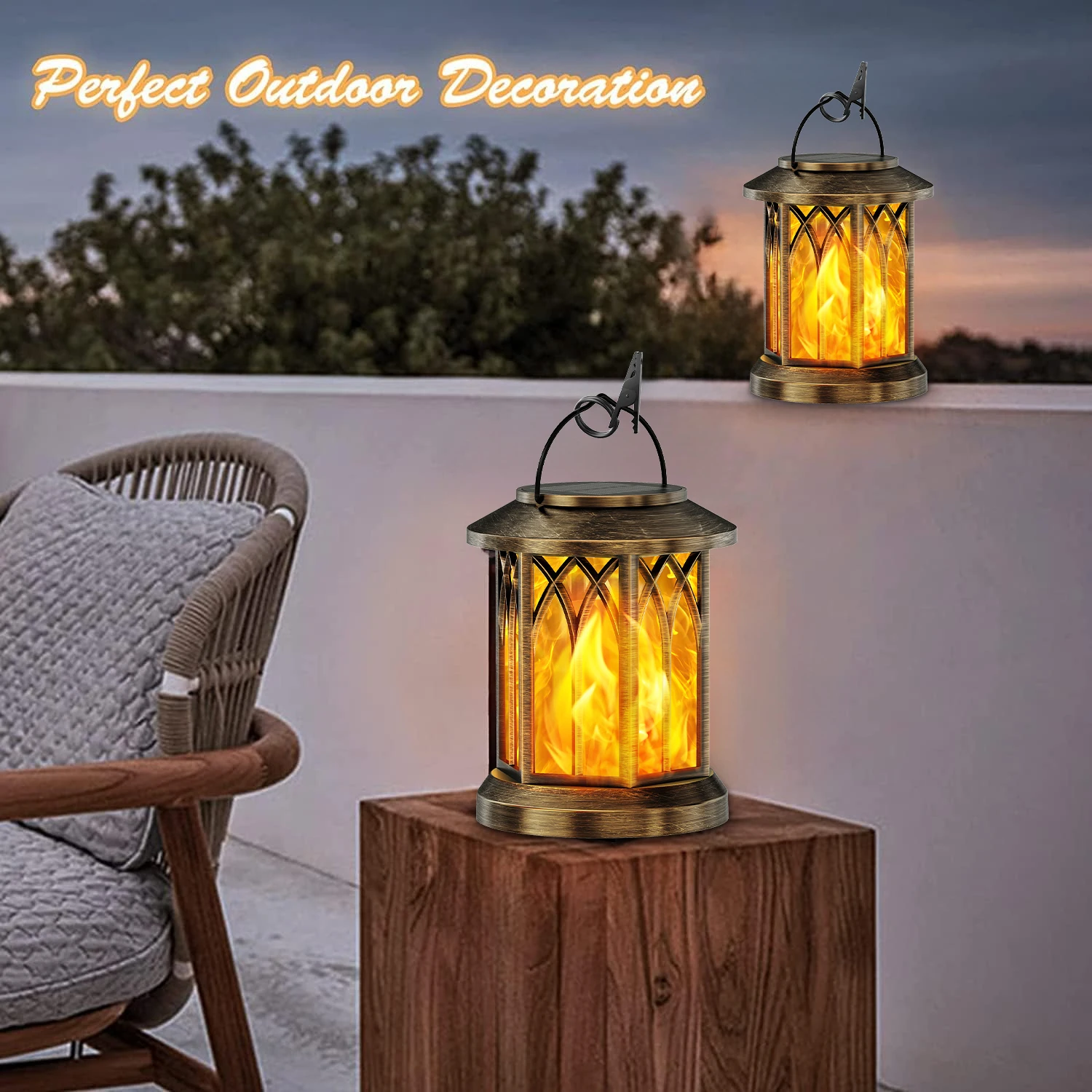 Bronze flickering flame solar lanterns glowing on a patio at sunset, with vintage design and hanging hook for outdoor decor.

