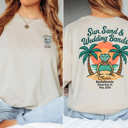 Beige t-shirt with 'Sun, Sand & Wedding Bands' design featuring palm trees and a sunset.