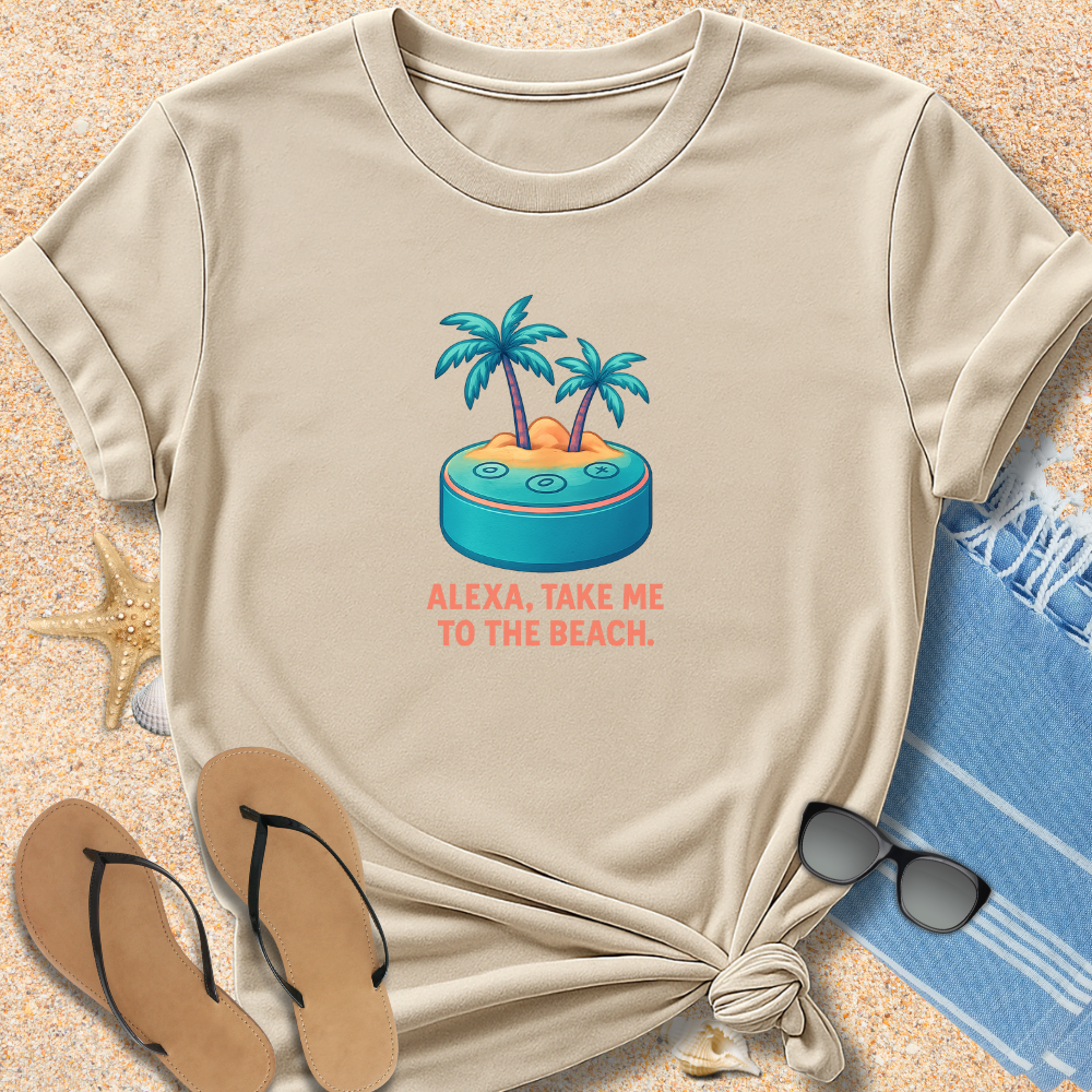 Beige t-shirt with beach-themed design and text on sand with flip-flops and towel.
