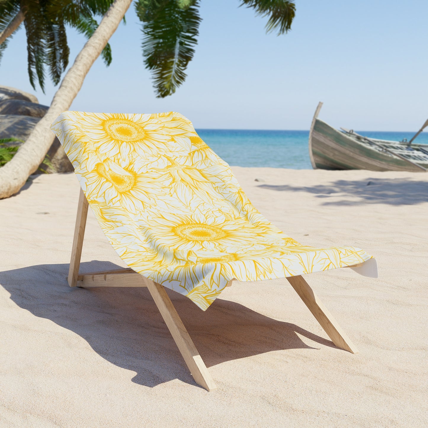 Yellow floral towel on a wooden chair at a beach with palm trees and ocean in the background