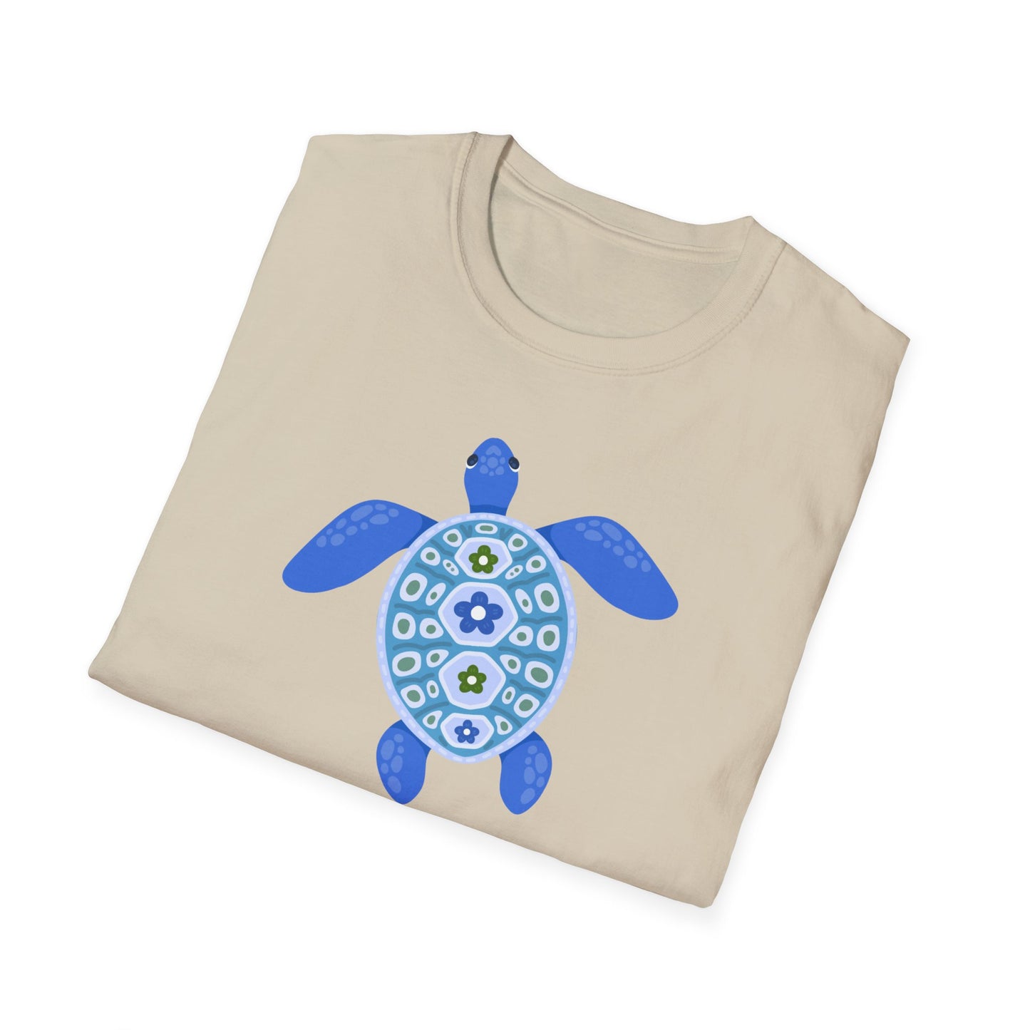 Folded beige t-shirt with a blue turtle design on a white background