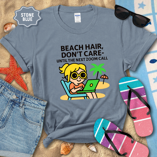 Stone blue t-shirt with beach-themed graphic and text, surrounded by beach accessories.