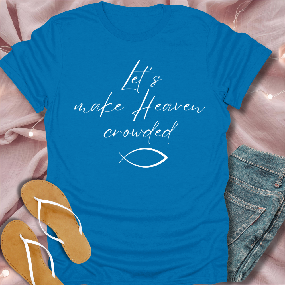 Blue t-shirt with text and fish symbol on a pink fabric background