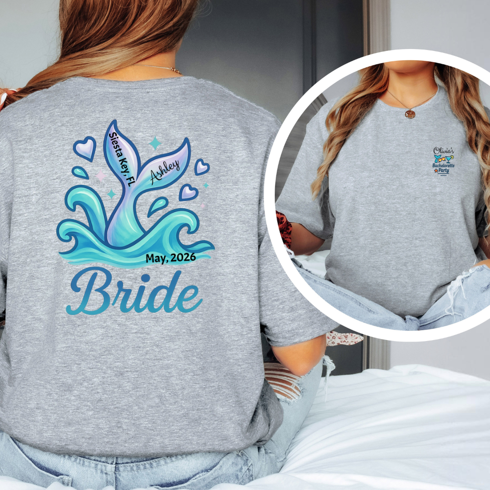 Gray t-shirt with blue ocean-themed design and text on the back, worn by a person.