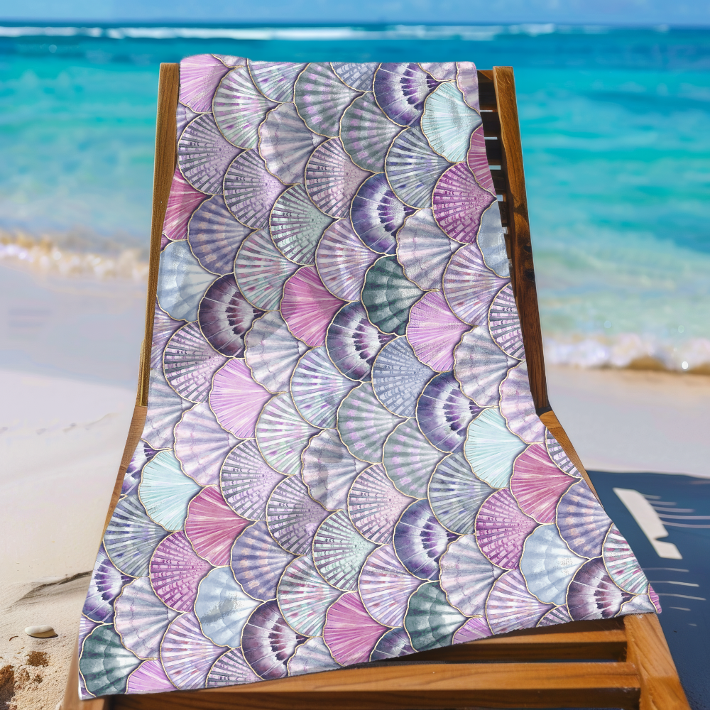 Towel with shell pattern on a beach chair by the ocean