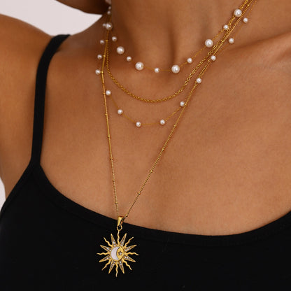Cosmic-themed pendant featuring diamond inlay and crescent moon