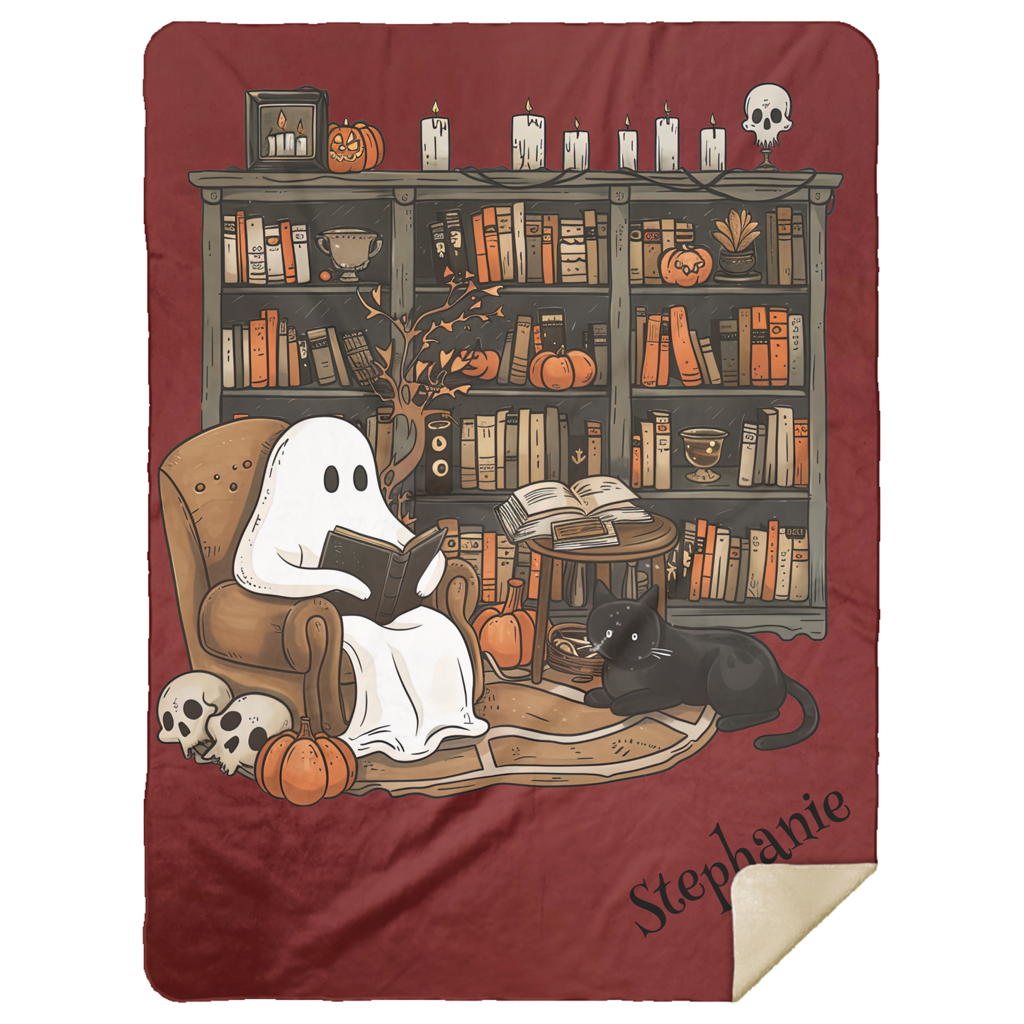 Blanket with a ghost reading a book and a cat in a cozy room setting, featuring pumpkins and candles.