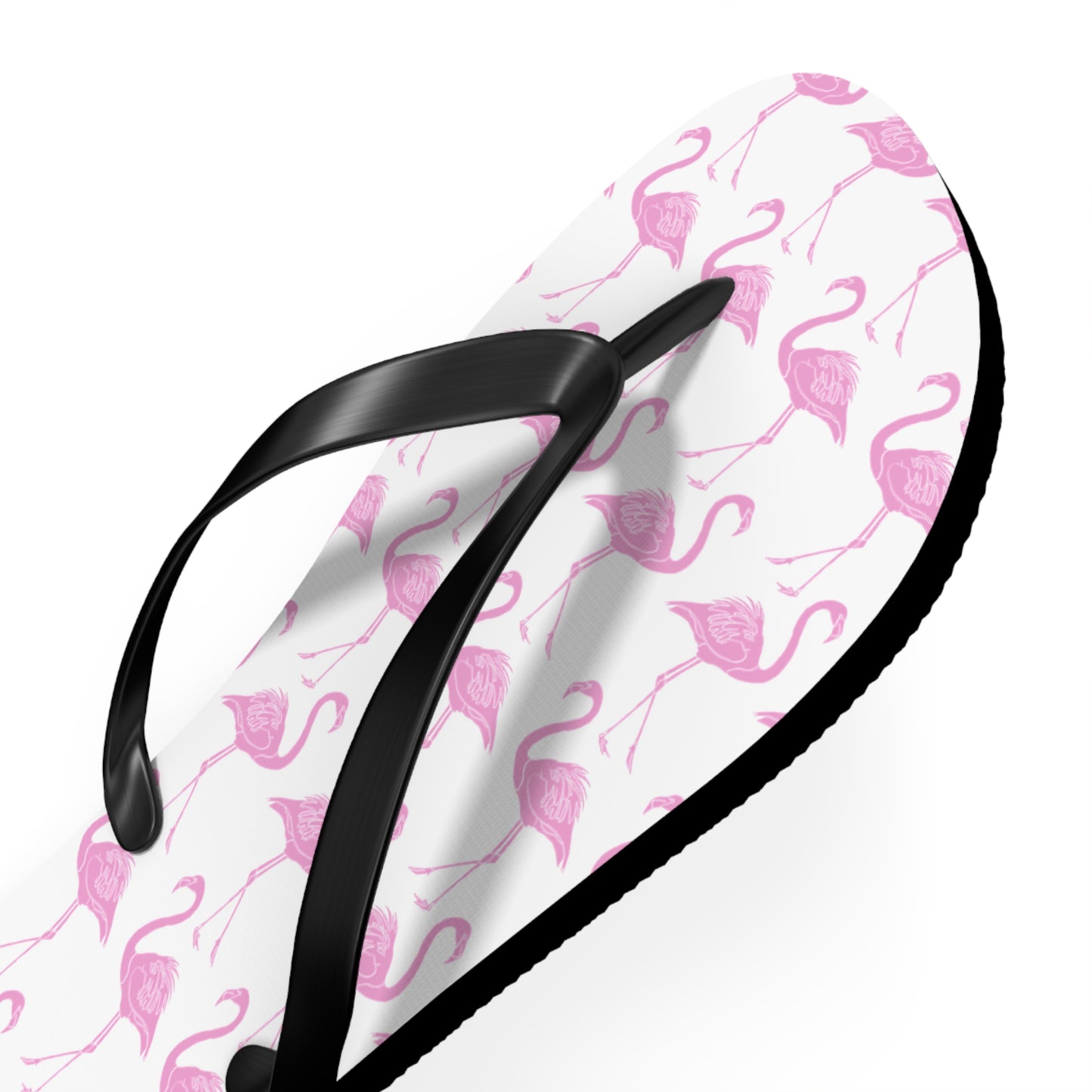 Flip-flop with pink flamingo pattern on a white background